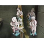 A pair of Meissen figures of a boy attaching a letter to a dove with a lamb to the base, and a