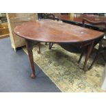 An 18th century oval drop flap supper table, on column legs and claw carved feet, 72cm h x 133cm