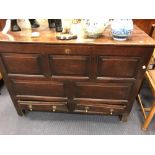 A George III oak mule chest with panel front and stile feet, 122cm wide, 88cm high