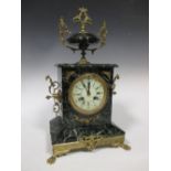 A French variegated green marble and ormolu mantle clock