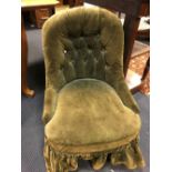 A Victorian nursing chair, buttoned green fabric upholstry, 77cm high