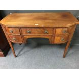A Regency style mahogany kneehole dressing table, with boxwood line inlaid border decoration