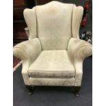 A George III style wing back armchair