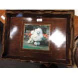 A nest of three wooden trays bearing poodle portraits