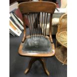 An Edwardian oak swivel desk chair, 94cm h