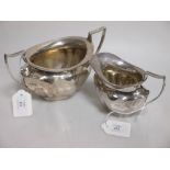 A silver sugar basin and matching cream jug by James Deakin & Sons, Sheffield 1912