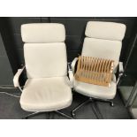 A pair of white leather office swivel chairs and a magazine rack (3) VAT is payable by the buyer