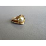 A single stone golden South Sea cultured pearl and 18ct gold ring by Paul Spurgeon, the 12mm pearl
