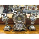 An early 20th century French champleve clock garniture