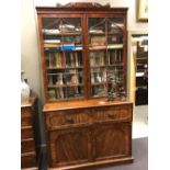 A William IV mahogany secretaire bookcase with scroll carved pediment, 244cm h X 133cm wide x 58cm d