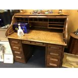 An early 20th century oak roll top desk, 115cm h x 120cm w x 77cm d