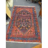 A red ground Hamadan rug
