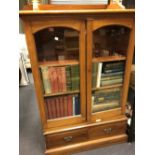 A Victorian glazed mahogany cupboard with two drawers to the base, 136cm h, together with a modern