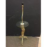 A mid-20th century painted metal standard lamp table, the twisted lamp arm above a circular glass