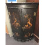 An 18th century lacquered bowfront corner cupboard, 92cm high