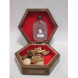 A silver mounted cut glass flask in a parquetry box with objets virtu