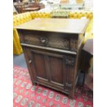 An old reproduction oak cupboard