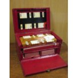 A red leather cased games box with bezique markers
