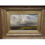 Arthur Gilbert, Meadows with cattle grazing and townscape beyond, oil on canvas in a gilt frame,