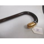A Tiffany & Co. gold mounted malacca walking cane, stamped Tiffany & Co., 18k