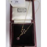 An Edwardian style amethyst and cultured pearl pendant on matching chain, both stamped 9ct,