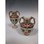 Two similar nineteenth-century Davenport twin-handled Imari pattern vases