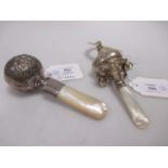 A Child's silver rattle and teether by Crisford & Norris, Birmingham 1931 and another with