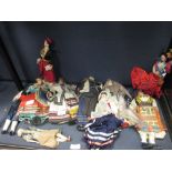 A collection of 20th century Greek and Spanish costume dolls together with a china doll and a