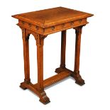 A Gothic style oak side table, the rectangular top above a frieze carved with quatrefoil motifs