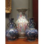 A pair of Oriental bottle vases and a Cantonese vase (3)