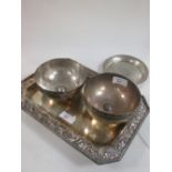 Three Indian silver metal bowls, 11.5cms, a small dish, and a plated octagonal dish with cast border