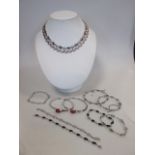 Two contemporary necklaces, both stamped 925, together with two cornelian open ended bangles, two