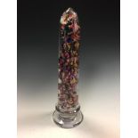 Attributed to Clichy, a glass mantle ornament, the tapering cylindrical column with multi-coloured