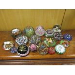 A large collection of mixed Continental glass paperweights