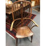 A 19th century ash and elm stick back Windsor armchair and a mahogany side chair with shaped