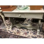 A grey painted side table with single frieze drawer, on lion paw feet, 72cm h x 106cm w