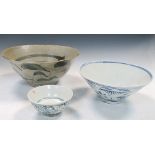 A Swatow type blue and white bowl and two others smaller, thelargest, 18.5cm (7.25 in) diameter (3)