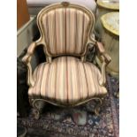 A French style painted show-frame fauteuil armchair, with striped upholstered fabric, 85cm h