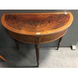 An Edwardian mahogany demi lune card table on column legs, 91cm wide