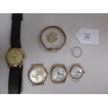 Three 9ct cased wristwatches together with another similar and a gilt metal watch and a platinum