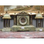 A Victorian onyx cased mantle clock and garniture copula
