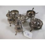 A silver six piece condiment set in the Georgian style comprising two pepperettes with four