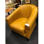 A modern India yellow leather upholstered armchair