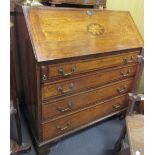 A 19th century oak bureau with satinwood inlay, fitted interior with two hidden compartments,
