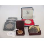 A Victorian gold sovereign (mounted) and various silver crowns and other coinage