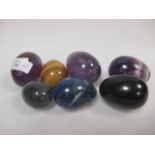 Seven egg hand coolers in lapis matrix, purple flourspar and tiger's eye