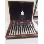 A Victorian twelve piece fruit service, with filled silver handles Sheffield 1838, mahogany cased