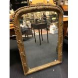A 19th c entury gilt framed mirror with an arched top, 105cm h x 73cm wide