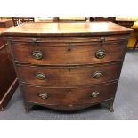 A 19th century mahogany bow fronted chest of drawers with brushing slide, on swept bracket feet,