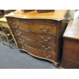 A George III style serpentine mahogany chest opening to reveal an empty interior to accommodate a TV